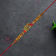 Antique Peacock Feather Rakhi With Beaded Thread thumbnail 1