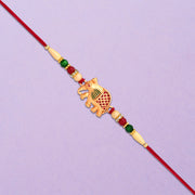 Golden Elephant Rakhi With Red Green Moti thumbnail 2