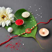 Traditional Circular Meenakari Rakhi With Floral Motif And Beaded Thread thumbnail 1