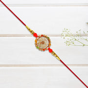Intricately Designed Circular Rakhi With Multicolor Accents And Red Thread For Rakshabandhan thumbnail 2