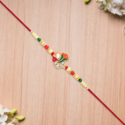 Divine Ganpati Rakhi With Enamel Work And Traditional Beads thumbnail 1