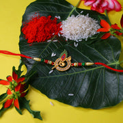 Krishna Flute Rakhi With Stone Studded Peacock Feather Design thumbnail 1