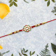 Kundan Work Floral Rakhi With Red Thread thumbnail 1