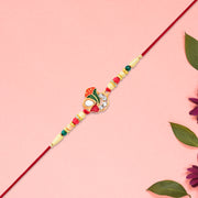 Divine Ganpati Rakhi With Enamel Work And Traditional Beads thumbnail 1