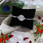 Stylish Rakhi With Intricate Floral Motif And Enamel Touches thumbnail 2