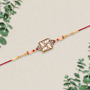 Designer Rakhi With Swastik-inspired Kundan Dial And Decorative Beads thumbnail 1