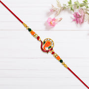 Golden Ganesha Rakhi With Red-green Beads And Stone Detailing thumbnail 1