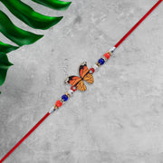 Vibrant Butterfly Rakhi With Colorful Beads  Red Mauli Thread thumbnail 1