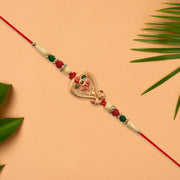 Designer Rakhi With Veena And Flower Charm thumbnail 2