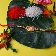 Traditional Ganesha Rakhi With Golden Finish And Sacred Red Thread thumbnail 2