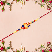 Designer Sun Motif Rakhi With Red And Blue Enamel Work thumbnail 1