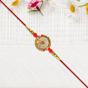 Intricately Designed Circular Rakhi With Multicolor Accents And Red Thread For Rakshabandhan thumbnail 3