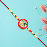 Round Designer Paisley Rakhi With Floral Charm thumbnail 2