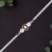Shiny Silver Rakhi With Ganesha Emblem And Elegant Dual Chain Design thumbnail 2