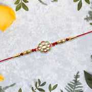 Kundan Work Floral Rakhi With Red Thread thumbnail 3