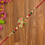 Traditional Rakhi With Bright Floral Centerpiece And Decorative Thread thumbnail 2