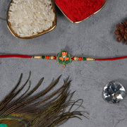 Green Tulsi Leaf Rakhi With Orange Enamel Flower And Beaded Thread thumbnail 1