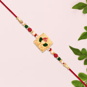 Golden Ganpati Rakhi With Red-green Beads And Enamel Detailing thumbnail 2