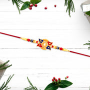 Designer Sun Motif Rakhi With Red And Blue Enamel Work thumbnail 2