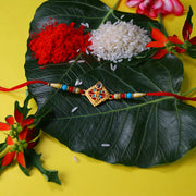 Traditional Diamond-shaped Rakhi With Stone Embellishments And Multicolor Beads thumbnail 1