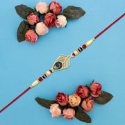 Peacock Feather Design Rakhi With Beaded Detailing And Red Thread thumbnail 3