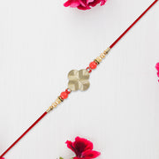 Rakhi With Multicolor Beads  Silver Accents On Red Thread thumbnail 3