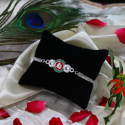 Shiny Silver Rakhi With Ganesha Emblem And Elegant Dual Chain Design thumbnail 3