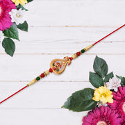 Designer Rakhi With Veena And Flower Charm thumbnail 3