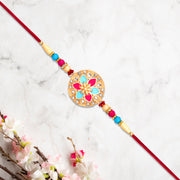 Round Floral Rakhi With Pink-blue Enamel And Beaded Thread thumbnail 1