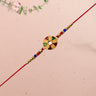 Elegant Multicolor Kundan Rakhi With Golden Floral Round Dial And Beaded Red Thread