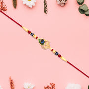Peacock Feather Design Rakhi With Beaded Detailing And Red Thread thumbnail 1