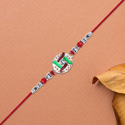Silver-tone Swastik Rakhi thumbnail 1