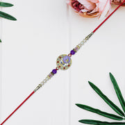 Elegant Ganesh Rakhi With Pearl And Purple Beads thumbnail 1