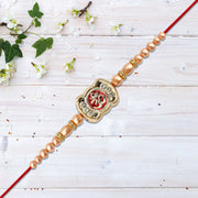 Om Rakhi With Stone Embellishments  Golden Beads thumbnail 1